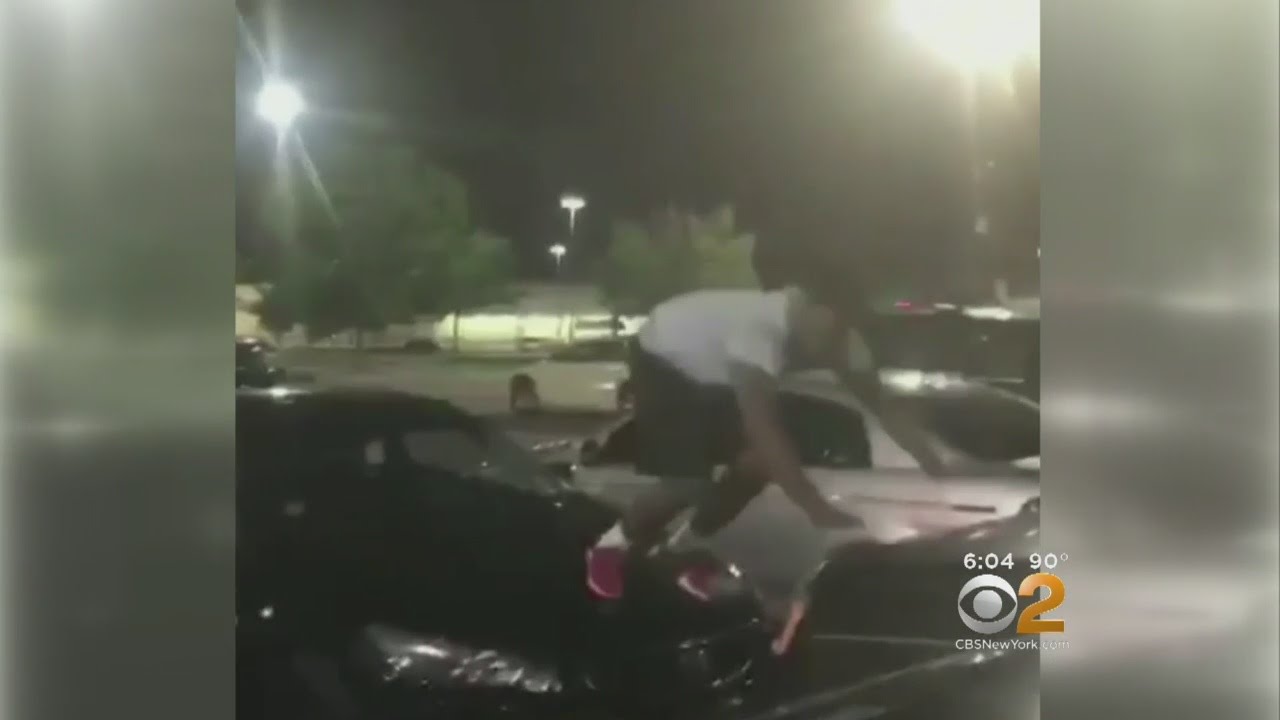 Men Caught On Camera Jumping On Cars In Linden Parking Lot - YouTube