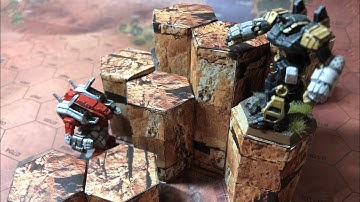 I designed papercraft hex hills for BattleTech and you can download and build them right now