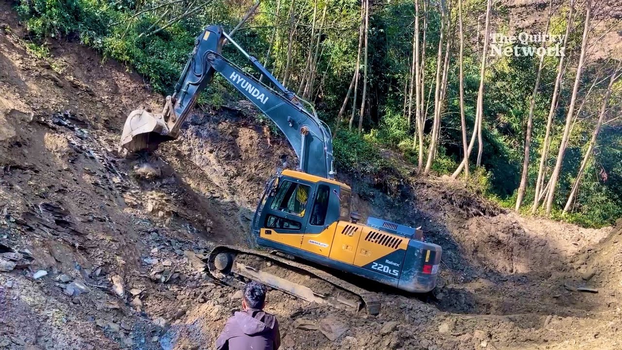 Excavator Cutting Hill to Improve Turning