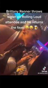 brittany renner throws water  to a fan at rolling loud