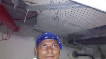 Actual above ceiling cable pulling in congested area