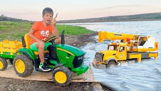 Darius wants to rescue the truck and help people from water with an excavator - Kidscoco Club