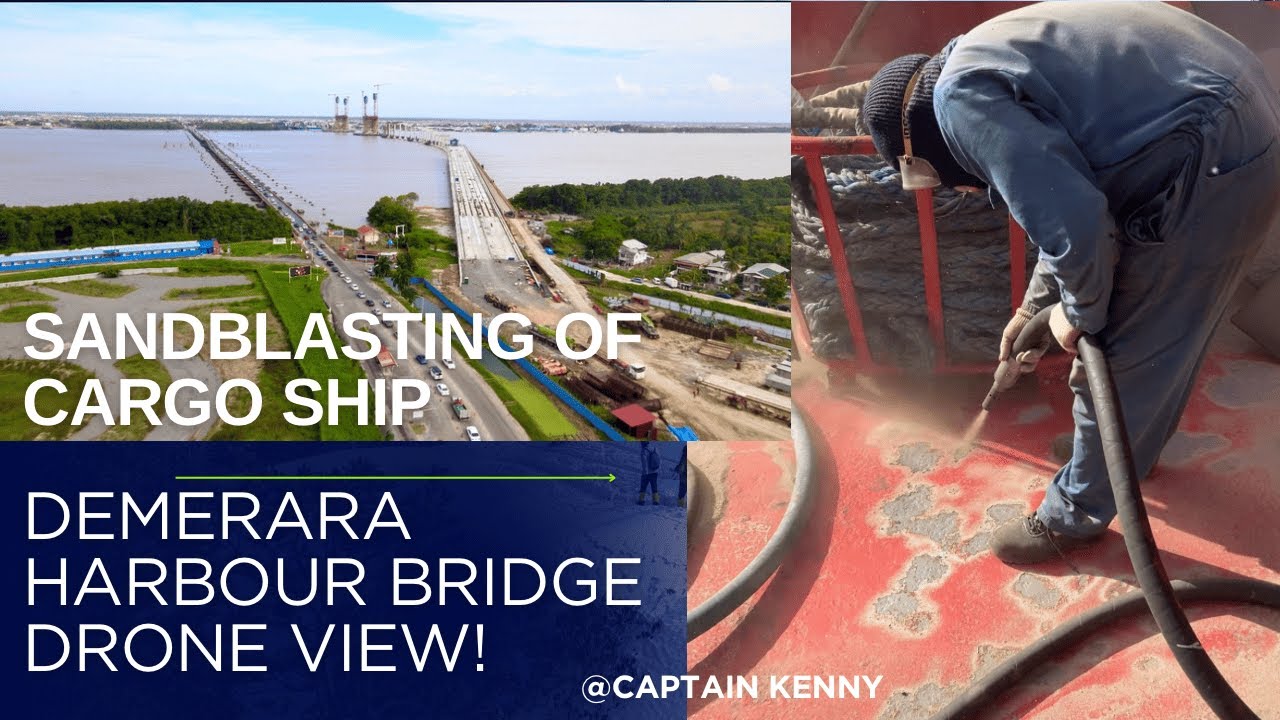 Пескоструйная обработка грузового судна в Гайане и вид на мост Демерара-Харбор-Бридж