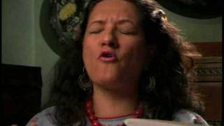 Sandra Cisneros reading student work in Spanish
