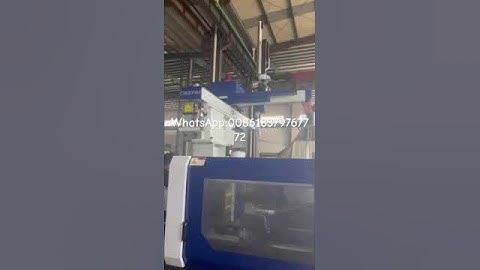 Plastic injection molding machine with servo motor testing with robot arm in Haijiang factory well