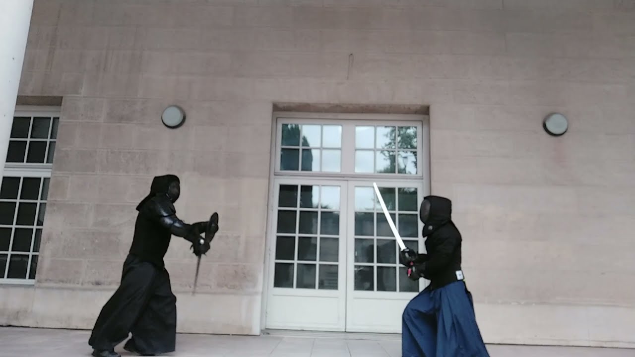 Combat/Sparring acier : Katana contre épée bocle