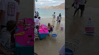 Waves Surge Up Beach Restaurant, Sweep Away Sandals