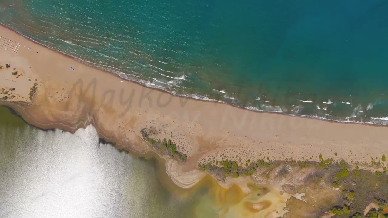 Dalyan, Turkey. Drone footage of vast empty Iztuzu Beach with strong sea waves breaking on golden...