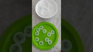 Number match with bottle caps with Mrs. Yang