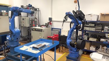 Synchronization of two industrial robots for welding operations