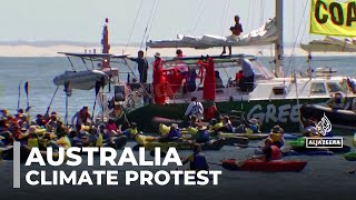 Australia climate protest: Police arrest 138 people after blocking ship