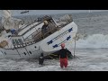 Lifeguards attempt to remove beached boat in playa del rey