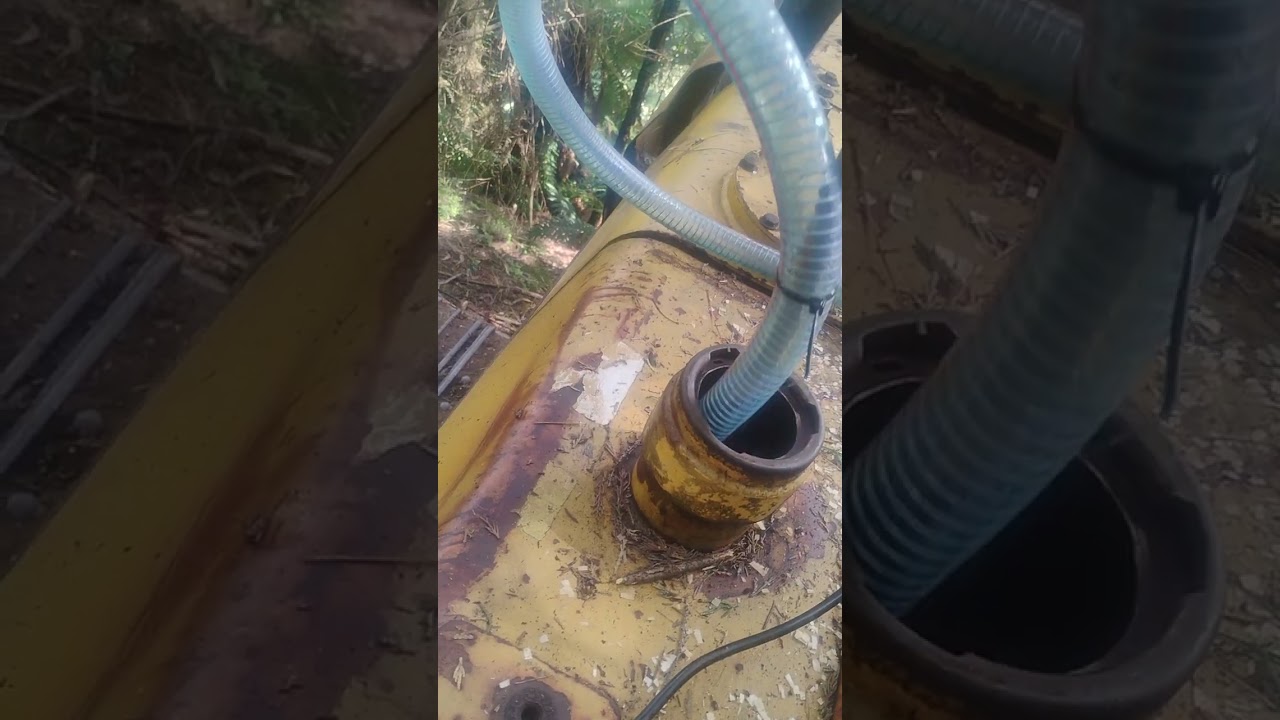 Dramas Rigging up a fuel transfer pump to remove contaminated diesel from the digger tank