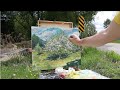 Plein air painting spring apple tree in bloom