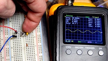 Electronics capacitors smoothing open push button switch stray signals oscilloscope measured
