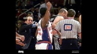 Marcus Camby punches Danny Ferry , Jeff Van Gundy gets the worse end of it