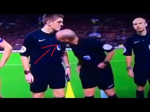 Mike Dean smelling his assistant referee!!!