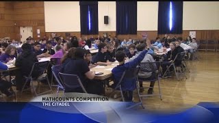 Rob Fowler hands out awards at the Annual Mathcounts Competition