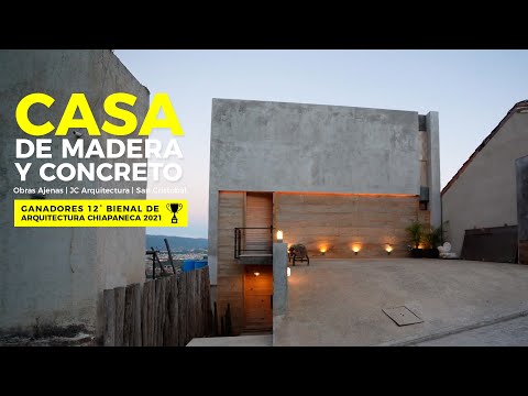 Video: Casa moderna con una fachada de hormigón y madera