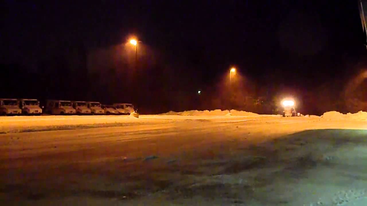 Truck and Loader Plowing In Blizzard