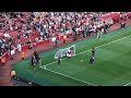 Emirates stadium  arsenal football club mascot gunnersauras faces a penalty kick 