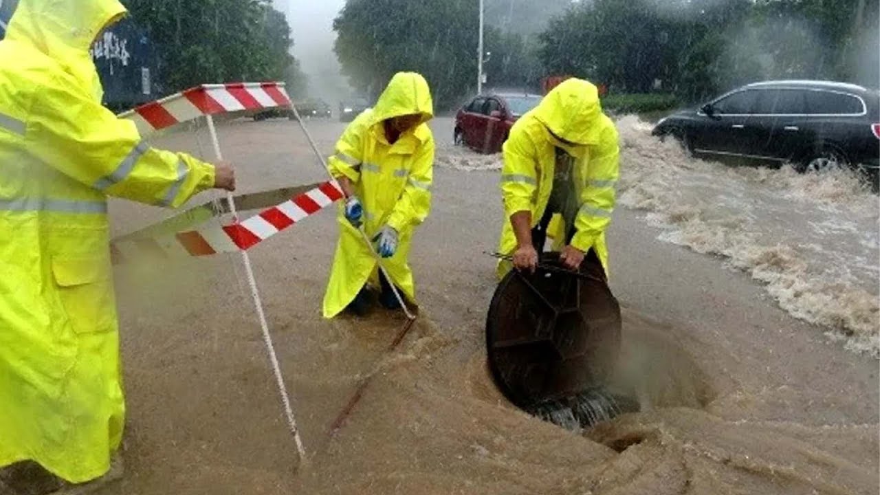 12-Emergency Drain Unclogging Clearing Flooded Streets After Heavy Rain ...