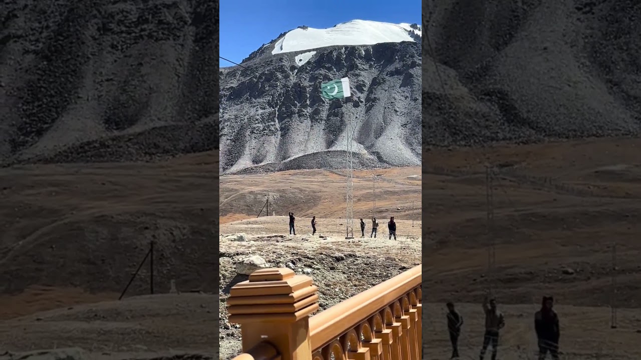 Pakistan's Flag at the Roof of the World Khunjrab Top