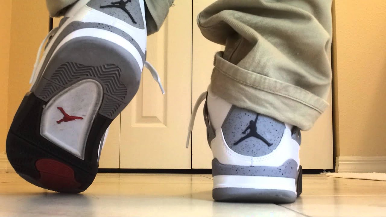 jordan 4 white cement on feet
