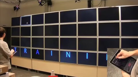 High-Precision Pointing on Large Wall Displays using Small Handheld Devices