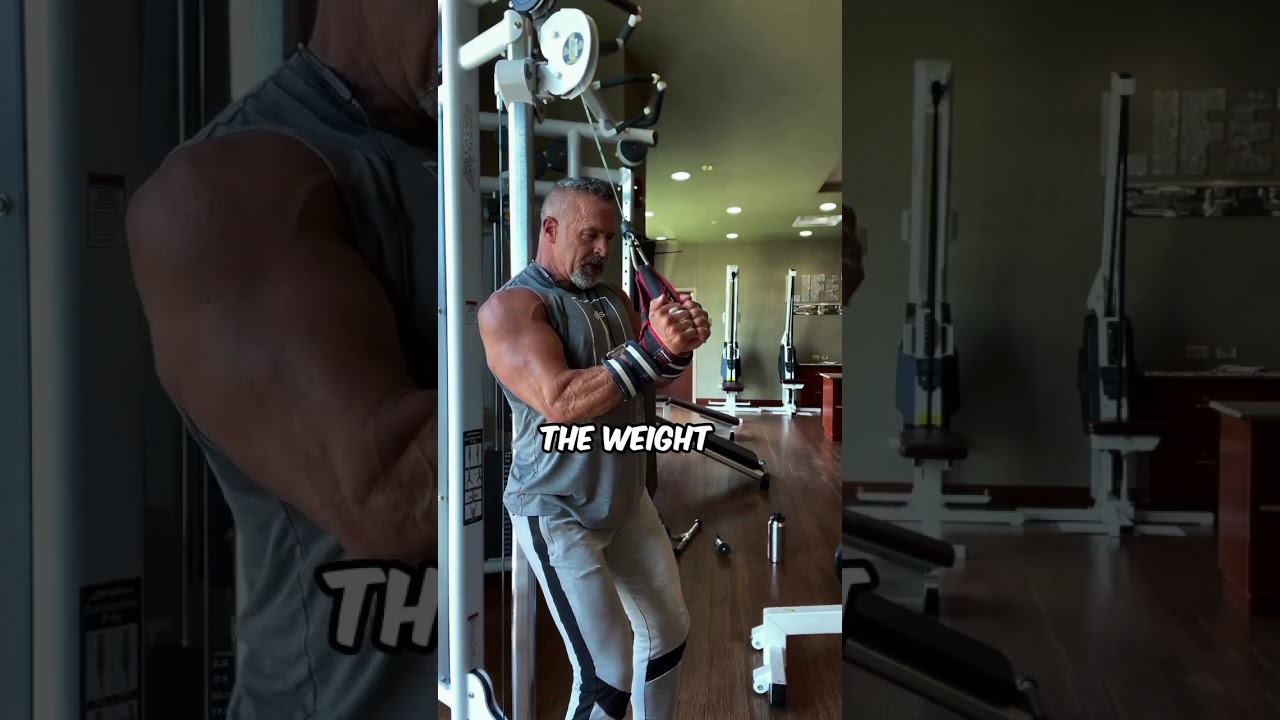 Tricep push downs facing away with your back against the machine while using your power straps