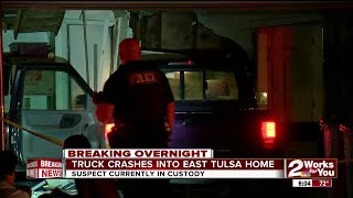 Man arrested after crashing truck into home