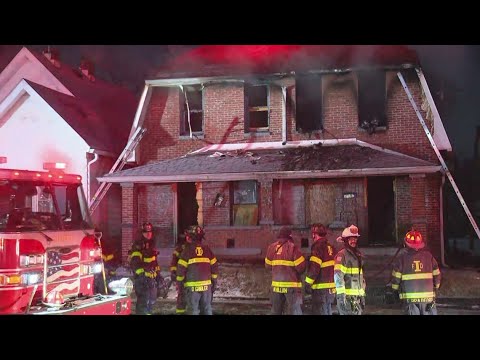 Car almost crashes into firefighters as they battle house fire in south ...
