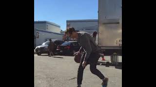 Reverse flash Harrison wells Tom Cavanagh shooting hoops on the flash set