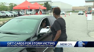 People who lost power during storms lined up to get gift cards for food