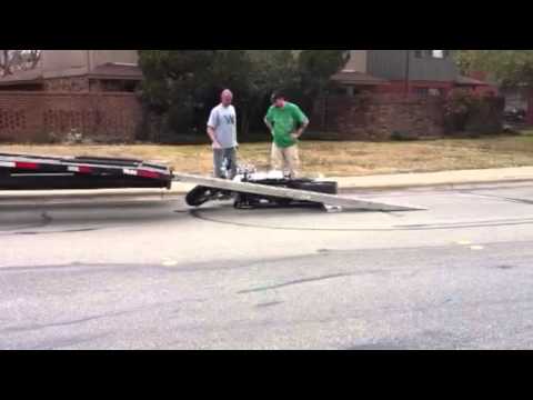 idiots loading a one of a kind expensive Harley Davidson