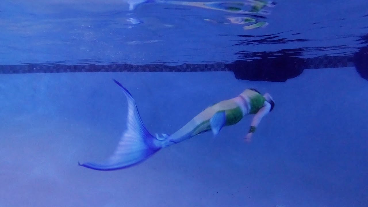 Mermaid Swims Outside at Night