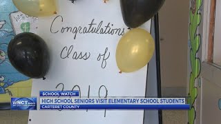 High school seniors visit elementary school students