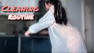 Cleaning The Kitchen In A Raincoat Wiping The Kitchen And Creating A Clean Mood