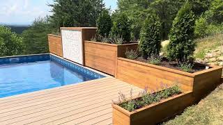 Building a pool on a mountain - fountain, planters and hidden solar cover