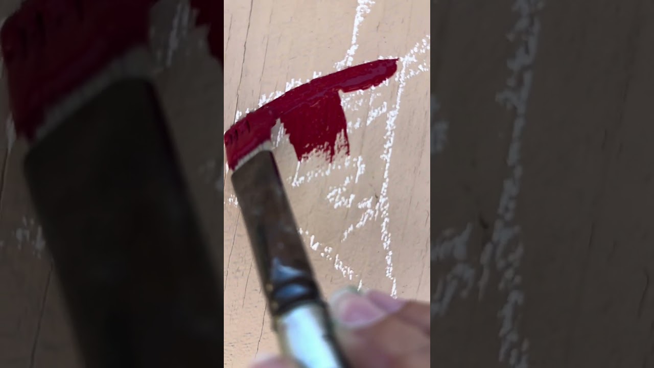 Artist paints a mural on a fence!