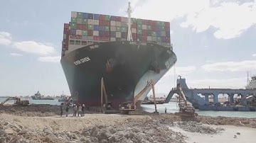 Salvage teams try to free container ship stuck in Suez Canal