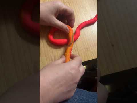 One of several ways make the Kaiser roll shape (demonstrated with play dough)