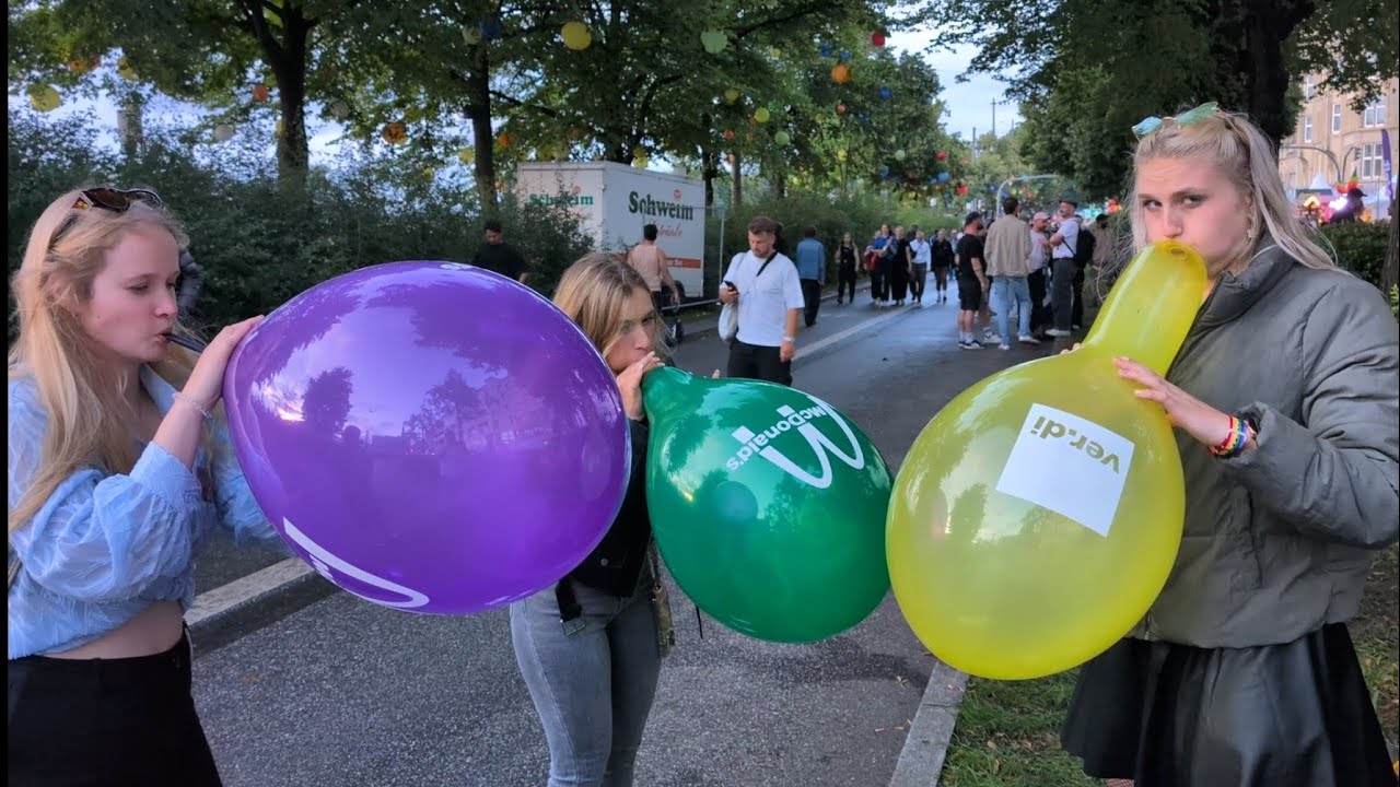 Girls blowing balloons at public Festival (Part 5) (Preview)