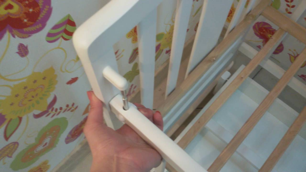 кроватка на нижнем уровне. опустить детскую кроватку. детская кроватка опустить дно. опустить детскую кроватку.