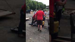 Caterpillar Track Forklift lifting a Yale Electric Pallet Jack saving the day for Shaw