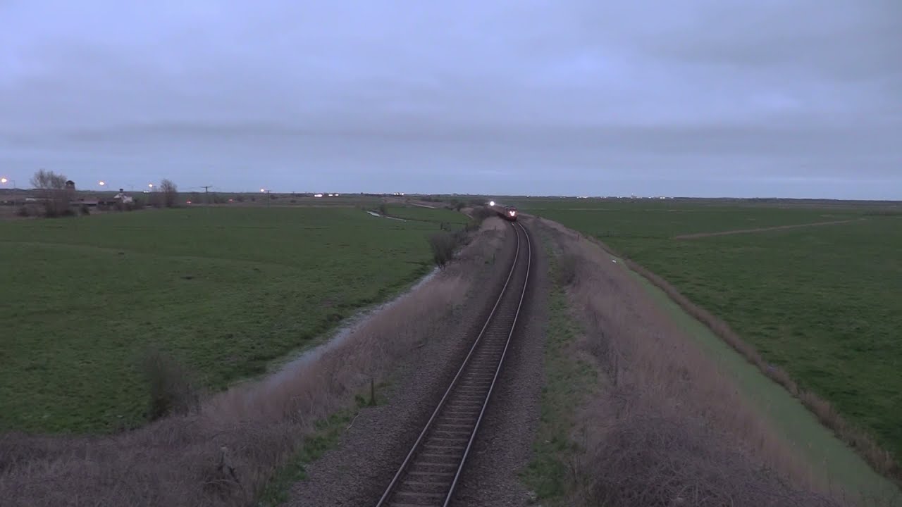 Colas Rail 37254 and 37610 pass Halvergate with 1Q98