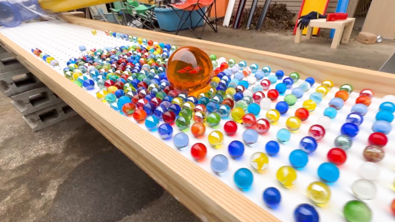 Rolling wooden marble run in a row The world