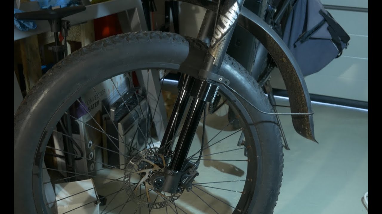 Extra seal for an inverted bicycle fork.That lubricates the fork stanchionstitled