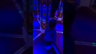 Little boy runs into mirror maze