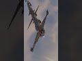 A detailed view of a sci-fi spaceship soaring through a cloudy sky